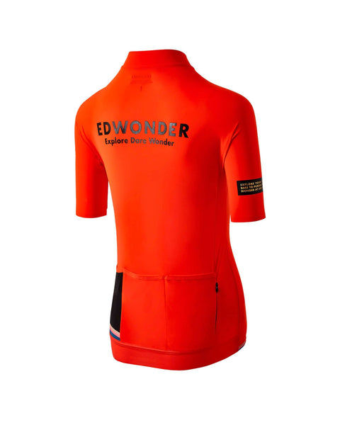 Women's EdW Edition Jersey in Cinnabar Orange, featuring a race fit, reinforced pockets, and stylish minimalist design.